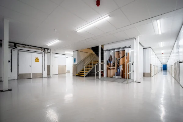 Clean self-storage corridor maintained by Total Care Cleaning for Hills Self Storage