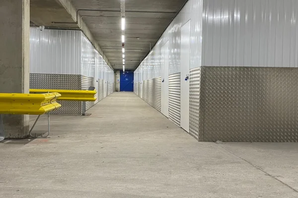 Clean self-storage corridor maintained by Total Care Cleaning for Hills Self Storage
