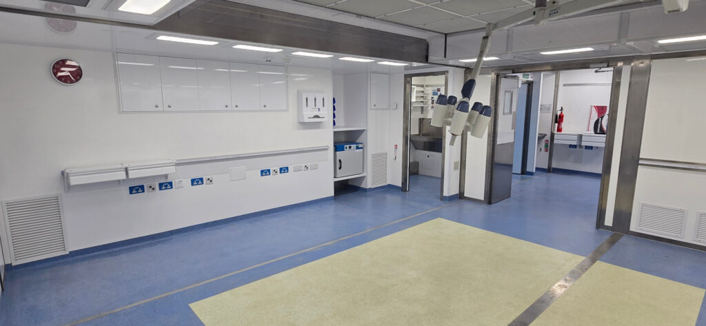 wide clinical room with clean flooring Clean clinical treatment area inside a Vanguard Healthcare mobile medical unit